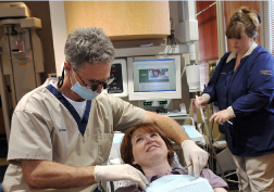 Dr. Poksay treating a patient