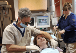 Dr. Poksay treating a patient