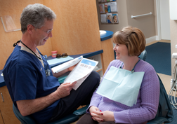 Dr. Poksay talking to a patient