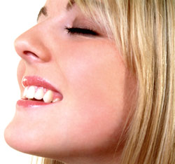 Woman closing her eyes and smiling